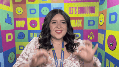 Woman In Front Of Wall Saying Let's Goooooo GIF