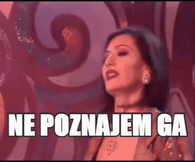 Woman In Front Of Wall Saying Ne Poznajem Ga GIF