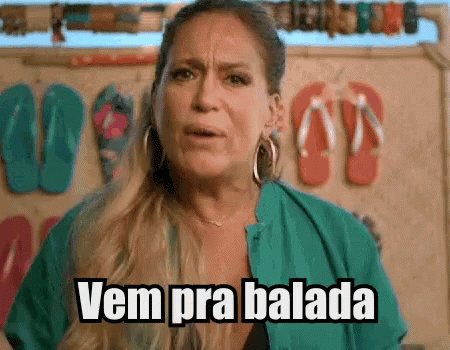 Woman In Front Of Wall With Flip Flops Says Vem Pra Balada GIF