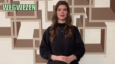 Woman In Front Of Wegweisen Wall GIF