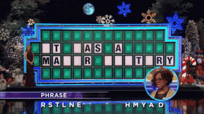 Woman In Front Of Wheel Of Fortune RSTLNE HMYAD GIF