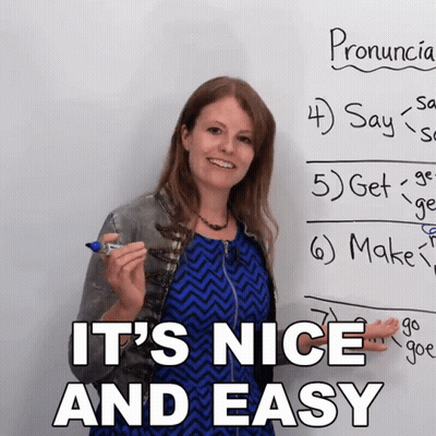 Woman In Front Of Whiteboard Saying It's Nice And Easy GIF