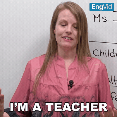 Woman in Front of Whiteboard Says I'm a Teacher