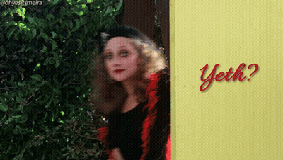 Woman In Front Of Yellow Sign Saying Yech GIF