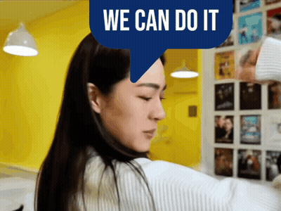 Woman in Front of Yellow Wall Saying We Can Do It