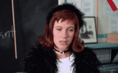 Woman In Fur Coat And Choker Blackboard Saying Kurt GIF