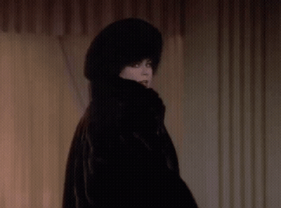 Woman In Fur Coat And Hat Smiling GIF