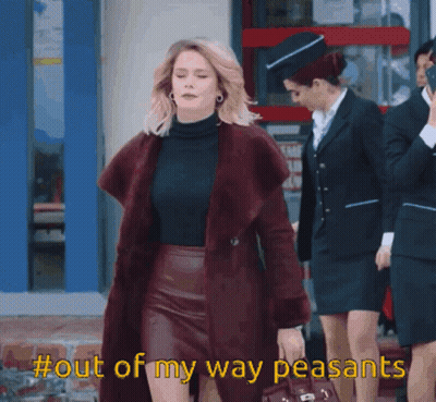 Woman In Fur Coat And Leather Skirt Says Out Of My Way Peasants GIF