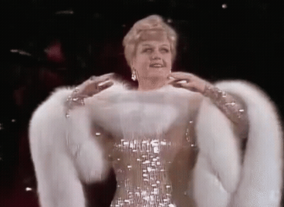 Woman In Fur Coat And Sequin Dress GIF