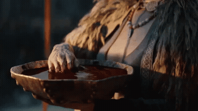 Woman In Fur Coat Holding Bowl Of Water GIF