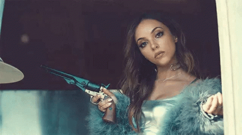 Woman In Fur Coat Holding Gun GIF