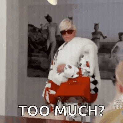 Woman In Fur Coat Holding Red Purse Too Much GIF