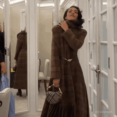 Woman In Fur Coat In Front Of Mirror Olivia Teengifs GIF