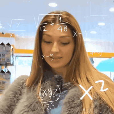 Woman In Fur Coat Looking At Math Chalkboard GIF