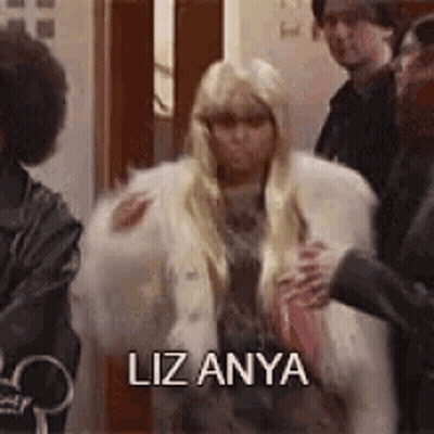 Woman In Fur Coat Says Liz Anya GIF