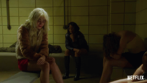 Woman In Fur Coat Sitting On Bathtub GIF