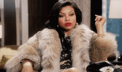 Woman In Fur Coat Sitting On Couch GIF