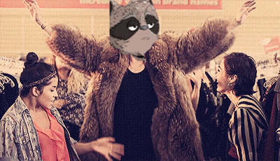 Woman In Fur Coat With Raccoon On Head GIF