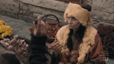 Woman In Fur Hat And Coat Talking To Another GIF