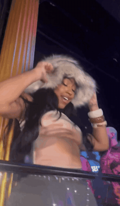 Woman In Fur Hat And Crop Top GIF