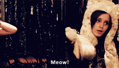 Woman In Furry Hat Meows GIF