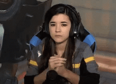 Woman In Gaming Chair Headphones Folded Hands GIF