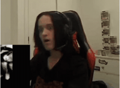 Woman In Gaming Chair Making Funny Face GIF