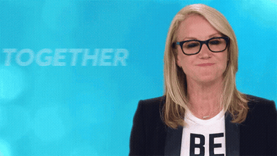 Woman In Glasses And Be Shirt GIF
