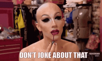 Woman In Glasses And Beanie Saying Not Funny GIF