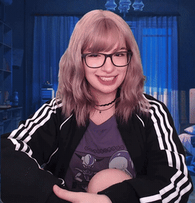 Woman In Glasses And Black Adidas Jacket Smiling GIF