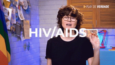 Woman In Glasses And Black Shirt Says HIV/AIDS GIF