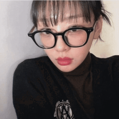 Woman In Glasses And Black Shirt With NY Logo GIF