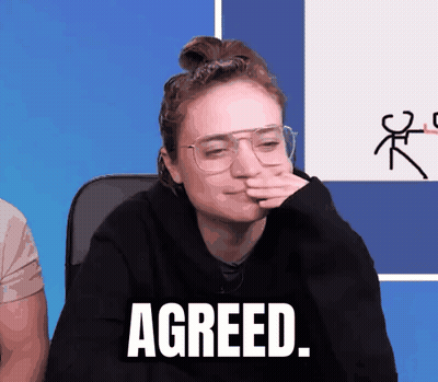 Woman In Glasses And Black Sweater Saying Agreed GIF