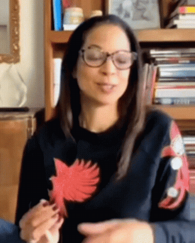 Woman In Glasses And Black Sweater With Red Bird Sleeves GIF