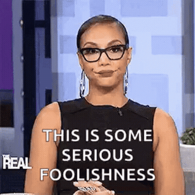 Woman In Glasses And Black Tank Top Making Funny Face GIF