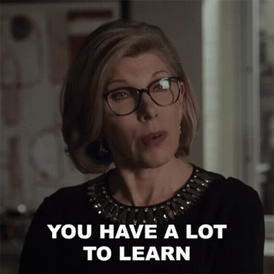 Woman In Glasses And Black Top Says You Have A Lot To Learn GIF
