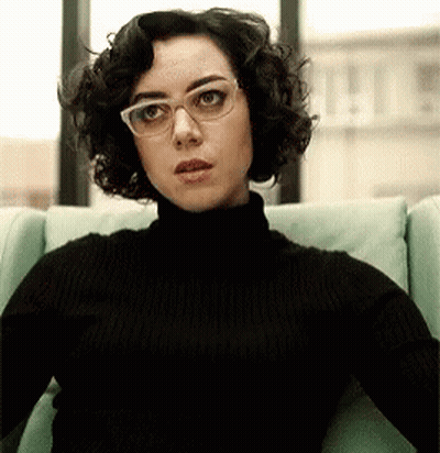 Woman In Glasses And Black Turtleneck GIF