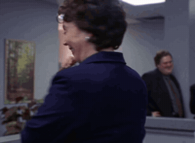 Woman In Glasses And Blue Jacket GIF