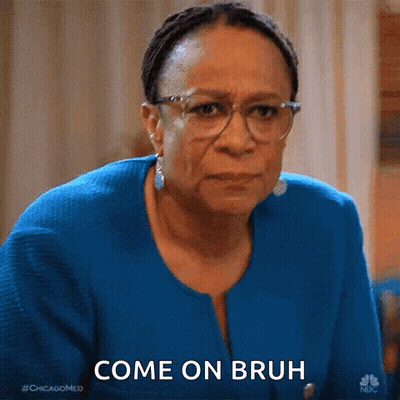 Woman In Glasses And Blue Jacket Making Funny Face Saying Come On Bruh GIF