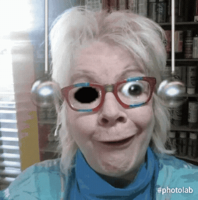Woman In Glasses And Blue Shirt With Black Eye GIF