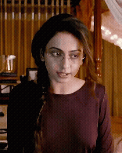 Woman In Glasses And Burgundy At Four Poster Bed GIF