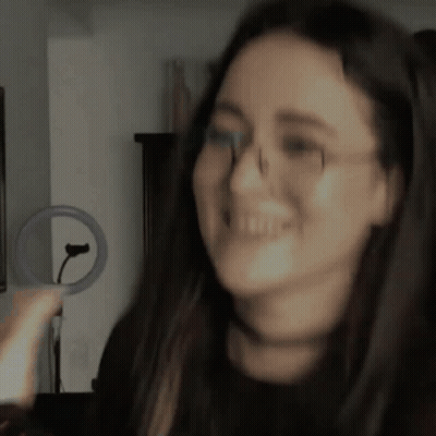 Woman In Glasses And Choker Smiling GIF