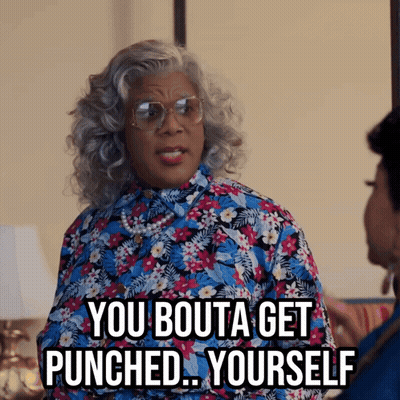 Woman In Glasses And Floral Shirt Saying You Bouta Get Punched Yourself GIF