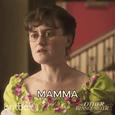 Woman in Glasses and Green Flower Dress Says Mamma