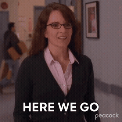 Woman In Glasses And Green Sweater Saying Here We Go GIF