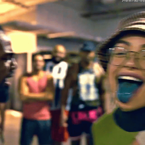 Woman In Glasses And Hat Laughing With Tongue Out GIF