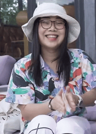 Woman In Glasses And Hat Smiling And Clapping GIF