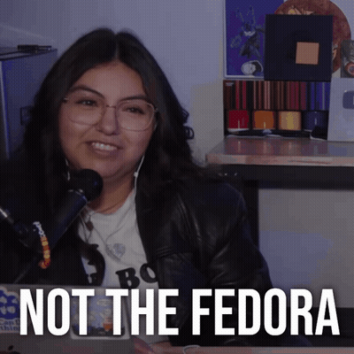 Woman In Glasses And Leather Jacket Smiling Not The Fedora GIF
