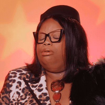 Woman In Glasses And Leopard Print Jacket Making Face GIF