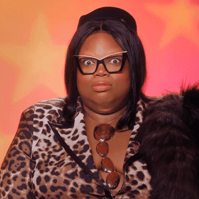 Woman In Glasses And Leopard Print Shirt Surprised GIF